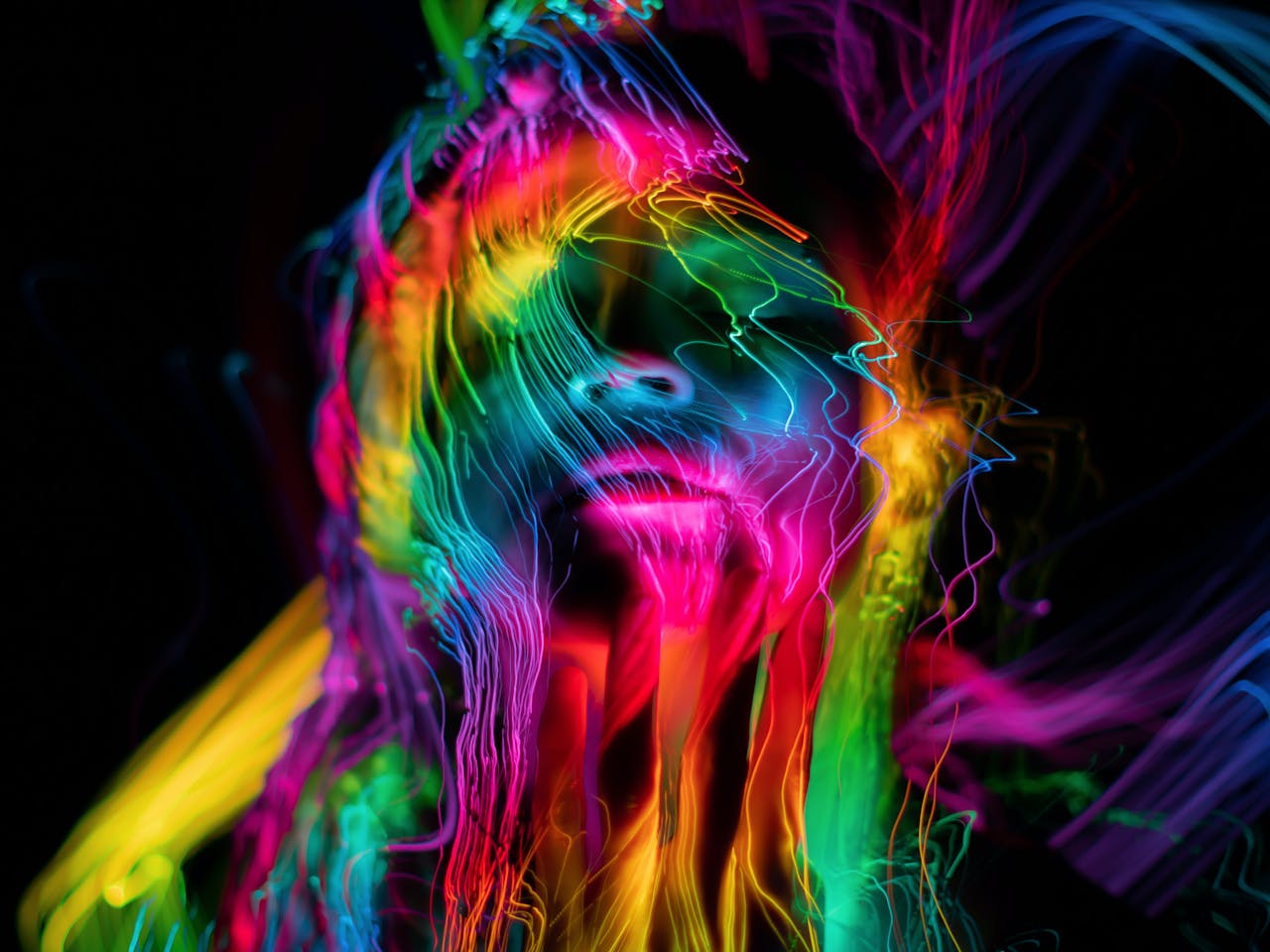 Colorful abstract neon portrait capturing luminescent waves and dynamic light.